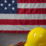 An american flag behind an helmet