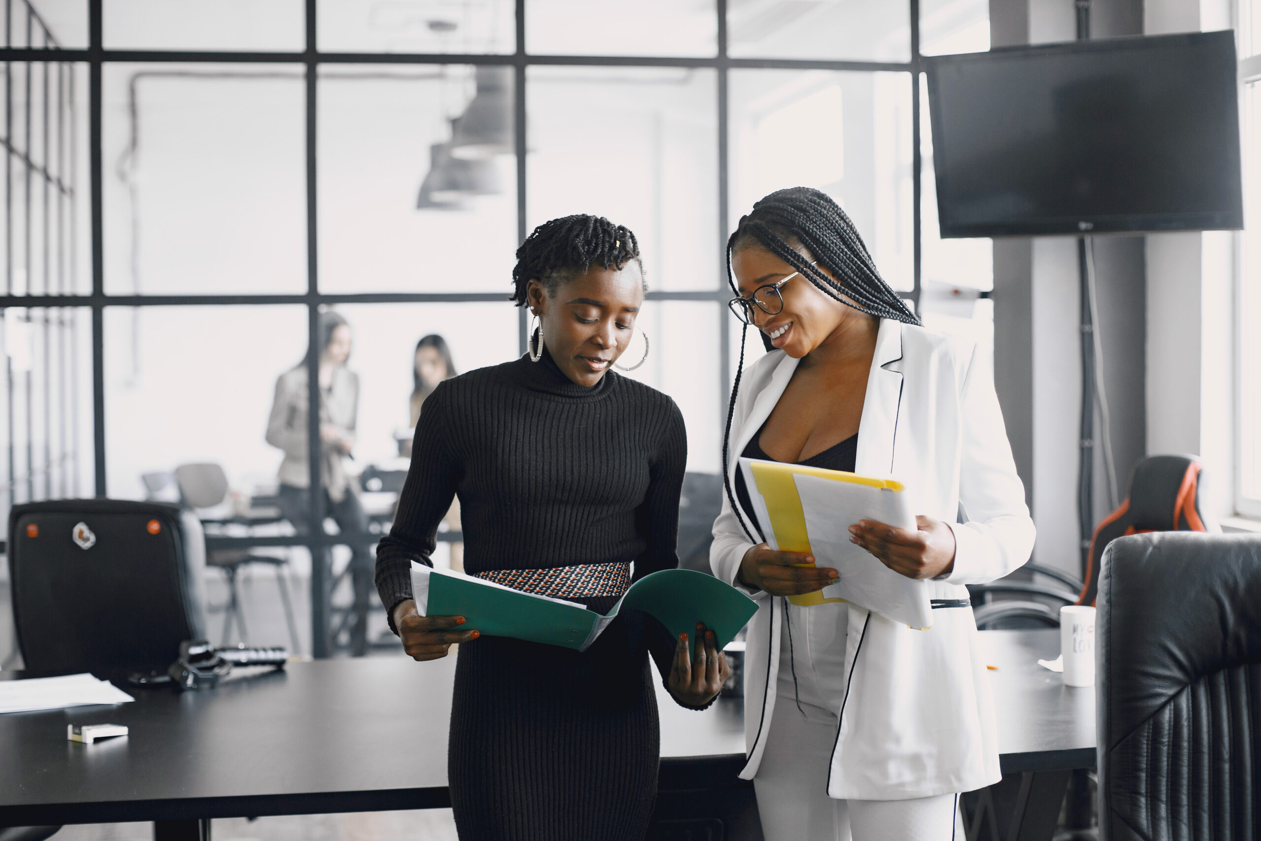 Two women talking in the office