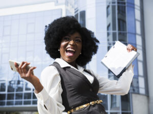 A black woman happy to secure a job abroad