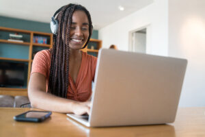 A young lady working on her laptop.